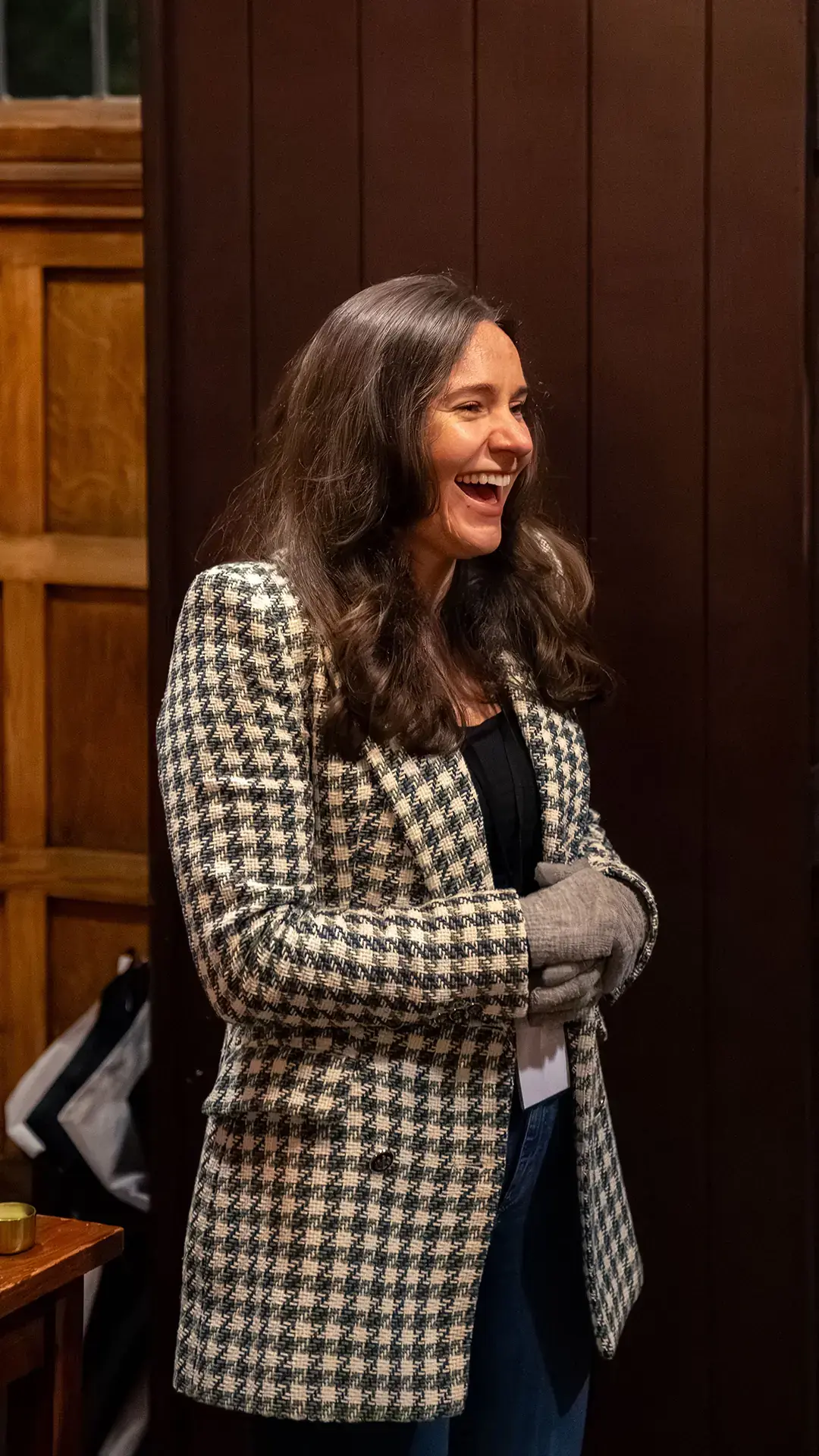 A woman laughing at a Rise gathering